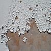 Closeup of cracked and peeling paint.