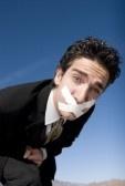 Businessman with a duct tape on his mouth stock photo