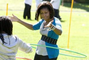 1-u-s-first-lady-michelle-obama-hula-hoops-at-healthy-kids-fair-on-south-lawn-of-the-white-house-in-washington_462