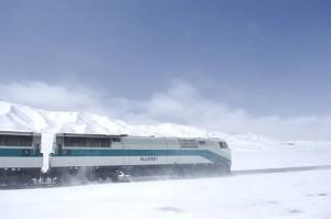 Tibet Train along the snow mountain