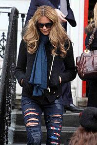 elle-macpherson-in-ripped-jeans-in-london-10