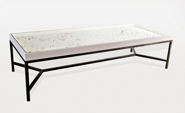 Alone in a Crowd table, by Rolf Sachs, 2010. The frame is made of oak and steel and under the glass surface Sachs has personally placed 511 Preiser miniature figures. Image copyright of Rolf Sachs, courtesy of Gabrielle Ammann Gallery, Cologne Design Miami, Design’art trop rare