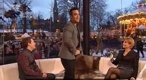 Robbie Williams pour 30 euros il montre ses fesses