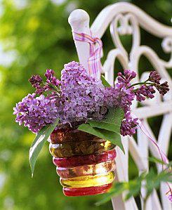 Lilac-in-glass-hanging-on-chair-back-272873.jpg