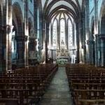 Espalion, église paroissiale Saint-Jean-Baptiste : Commencée en 1879, la nouvelle église est consacrée le 3 octobre 1880 et reste sous le vocable de St Jean-Baptiste, l'ancienne église étant désaffectée. La nouvelle église paroissiale est l'œuvre de l'architecte ruthénois Grinda. P1060223.JPG