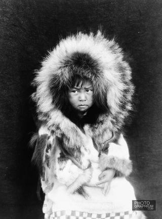Noatak-child-three-quarter-length-portrait-seated-facing-front.-Noatak-Alaska.-1929.-Photo-Edward-S.-Curtis