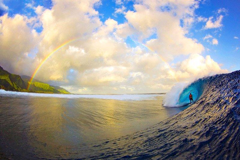 Photoshopped or not Photoshopped? You have to ask that question because this photo is… perfect. The rainbow is perfectly positioned between the dreamy island and the curling wave. Surfer Christian Redongo is perfectly posed under the wave’s powerful and, well, perfect arc. And yet, this photograph, taken by Zak Noyle, age 26, near Teahupoo, Tahiti, is real. It really is a once in a lifetime snapshot.