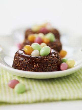 Crunchy chocolate nests filled with multicolored sugar Easter eggs Festival gourmand