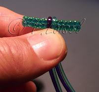 Superposition de scoubidous à 4 fils Superposition de scoubidous à 4 fils