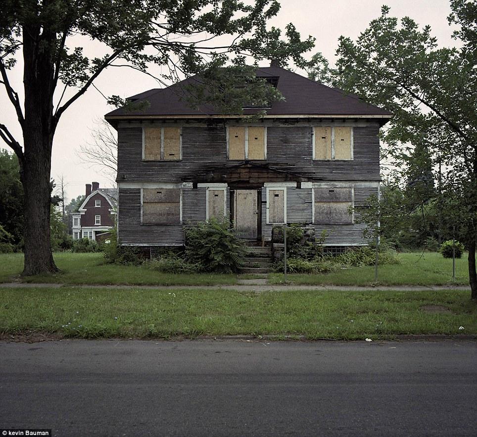 Struggling: During the project, the photographer found Detroiters struggling to make a life among abandoned and burned out houses