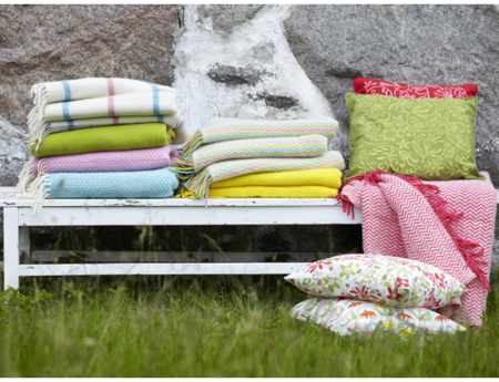 Bench-with-colourful-wool-throws-and-cushions