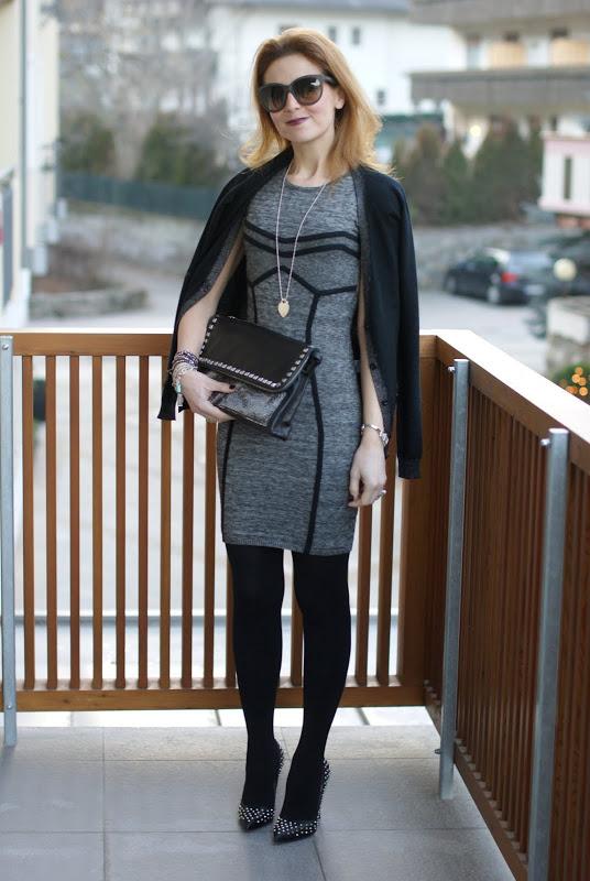 Executive woman Guess dress, studded pumps, Maison Scotch cardigan