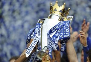 Chelsea players celebrate with trophy after winning the English Premier League at Stamford Bridge in London