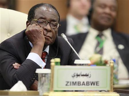 Zimbabwe's President Mugabe sleeps during the speech of Libya's leader Gaddafi at the start of the third EU-Africa summit in Tripoli
