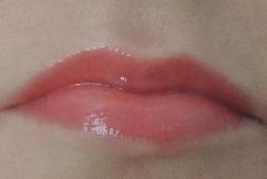 Revlon Coral Reef gloss swatch Revlon Coral Reef gloss swatch