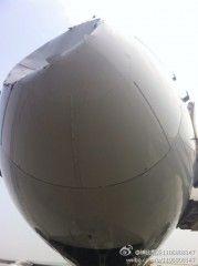 Cliquer pour agrandir Un avion d'Air China percute un objet non-identifié à 8000 mètres d'altitude