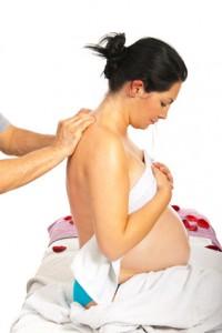 Pregnant receiving back massage
