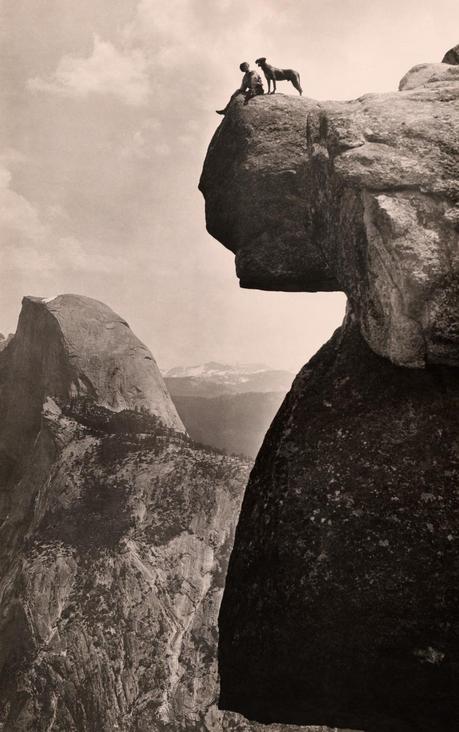 A man and his dog on the Overhanging Rock in Yosemite National Park, May 1924.Photograph by Educational-Bruce Photograph