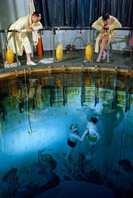A submarine trainee and instructor rise to the surface of a training tank in New London, Connecticut, November 1952.Photograph by David Boyer, National Geographic