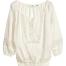 Mode bio : les coups de coeur pour la saison printemps été 2014 Blouse bohémienne H&M Conscious Blouse en coton biologique tissé vaporeux avec boutonnage et broderies en haut. Modèle avec incrustations de bandes en dentelle ajourée et manches 3/4 terminées par élastique. Smock à la base. Prix indicatif : 29,95€ sur le site www2.hm.com/fr