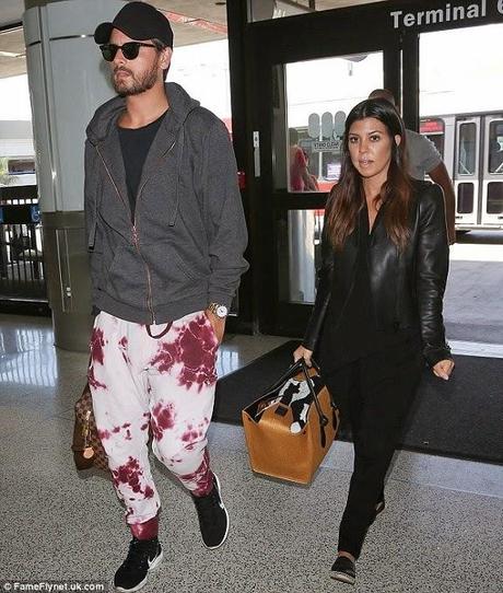 Scott Disick et Kourtney Kardashian à l'Aéroport LAX de Los Angeles - 10.05.2014