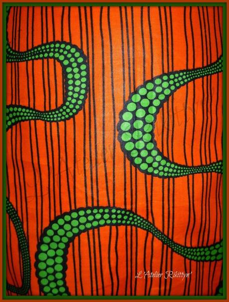 Mini-jupe en Wax orange et serpents verts Mini-jupe en Wax orange et serpents verts