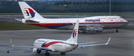 Malaysia Airlines aircrafts taxi on the runway at Kuala Lumpur International Airport in Sepang outside Kuala Lumpur
