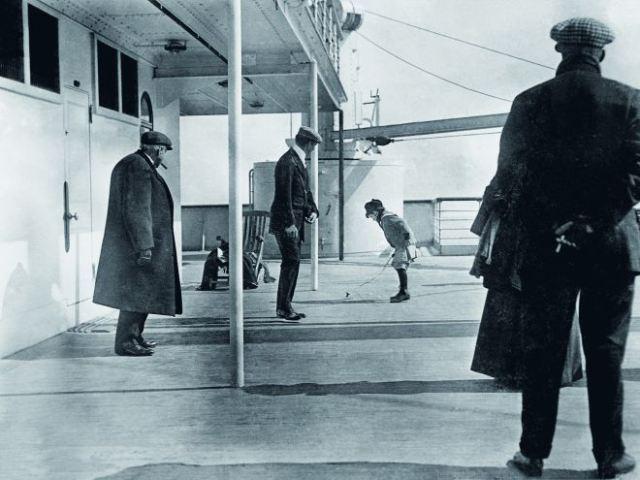 A boy plays aboard the deck of the Titanic