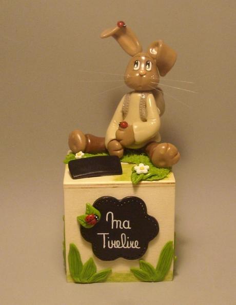 Tirelire avec lapinou en porcelaine froide Tirelire avec lapinou en porcelaine froide