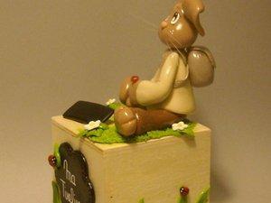 Tirelire avec lapinou en porcelaine froide Tirelire avec lapinou en porcelaine froide