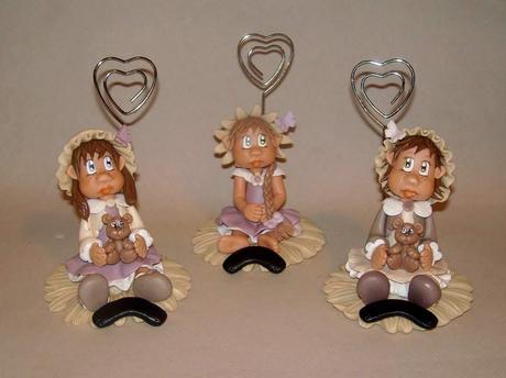 Porte -photo avec bébé fillette en porcelaine froide Porte -photo avec bébé fillette en porcelaine froide