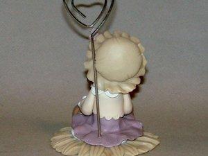 Porte -photo avec bébé fillette en porcelaine froide Porte -photo avec bébé fillette en porcelaine froide