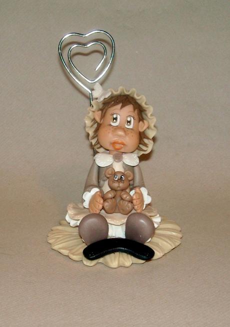 Porte -photo avec bébé fillette en porcelaine froide Porte -photo avec bébé fillette en porcelaine froide