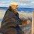 1901, Anna Ancher : Michael Ancher målande på stranden
