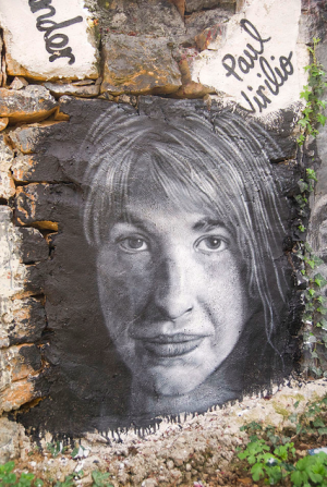 Graffiti à l'effigie de Naomi Klein, Saint-Romain-en-Mont-d'Or. (Wikicommons).
