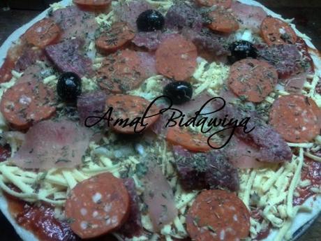 Pizza del mama: Peperoni,viande haché et poulet Pizza del mama: Peperoni,viande haché et poulet