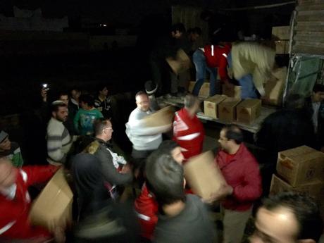 Boxes of aid are delivered at night as a joint convoy of the International Committee of the Red Cross (ICRC), the Syrian Arab Red Crescent (SARC) and the United Nations yesterday reached several villages in the region of Al Houleh, north of Homs. The convoy brought food, medicine and water supply equipment for more than 70,000 people. Majda Flihi/ICRC