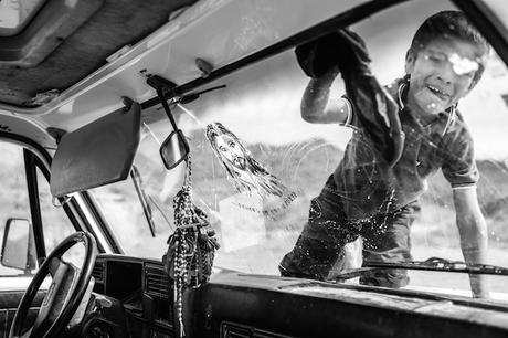 Cachi - Argentina, Thomas 6 Years old helping his father cleaning his truck after a long day of work transporting horses from file to cachi