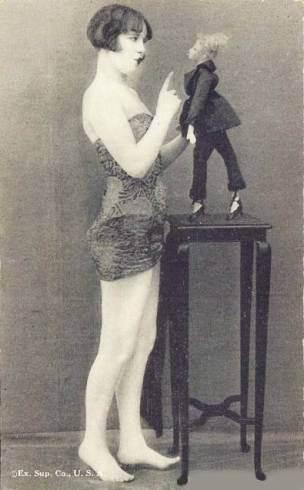 1920 ca postcard-chcago-arcade-card-exhibit-supply-company-pin-up-woman-by-table-with-woman-puppet-