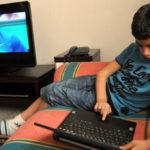 6 year old  Khalil plays with his PC laptop at home, on May 25, 2010 in Tunis,. AFP PHOTO : FETHI BELAID