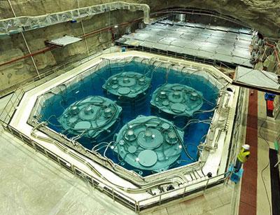 Photograph of four of the Daya Bay antineutrino detectors