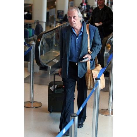 Carradine was spotted going through airport security at LAX on April 8, 2009.
