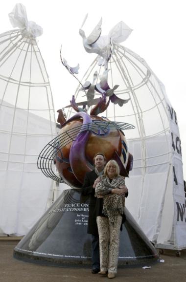 Julian Lennon, son of the late Beatle John Lennon, stands with his mother Cynthia in front of the John Lennon peace monument in Liverpool, northern England October 9, 2010. The monument by U.S. artist Lauren Voiers was commissioned by the Global Peace Initiative and unveiled on Saturday to mark what would have been Lennon's 70th birthday. REUTERS/Stringer (BRITAIN - Tags: ENTERTAINMENT SOCIETY OBITUARY)