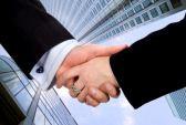 business deal - male and female in a corporate environment stock photo