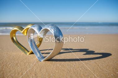 istockphoto 9246535-silver-and-gold-heart-shine-on-the-beac