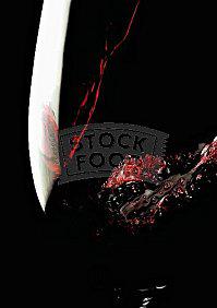 Pouring red wine into glass (close-up)-987153