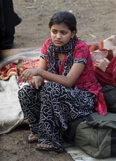 Image: Rubina Ali, who acted in the oscar-winning film Slumdog Millionaire, sits amid the ruins of the Gharib Nagar slum in Mumbai
