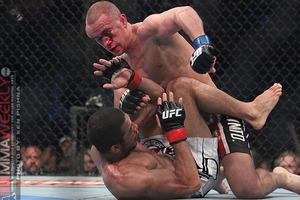 A battered Mark Hominick poured it on in the final moments but it was too little too late at Jose Aldo held on to win. Photo by Ken Pishna via MMA Weekly.