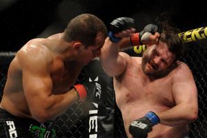 OAKLAND CA - AUGUST 07:  Junior dos Santos punches Roy Nelson during the UFC Heavyweight bout at Oracle Arena on August 7 2010 in Oakland California.  (Photo by Jon Kopaloff/Zuffa LLC/Zuffa LLC via Getty Images)