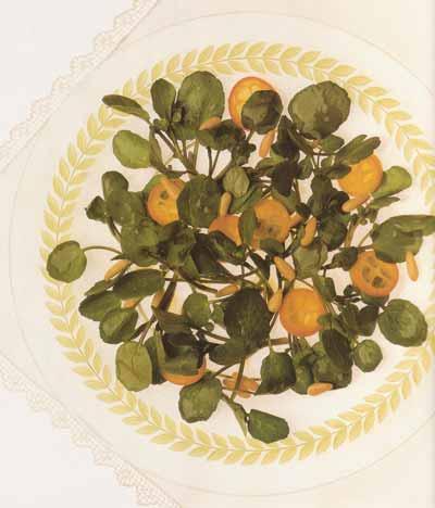 Salade de cresson et kumquats aux pignons de pin grillés